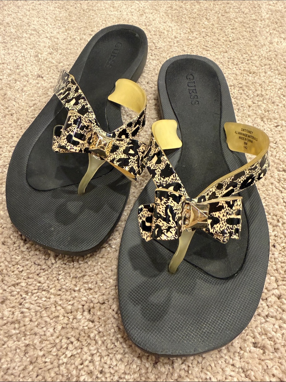 GUESS Black Sandal with Gold Accents and Animal-Print Bow